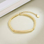 Gold Beaded Chain Bracelet With Dainty Topaz Curved Bar With Clasp